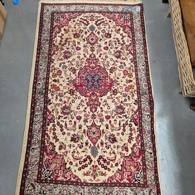 Lot 983 - An oriental rug of classic Persian design 162...