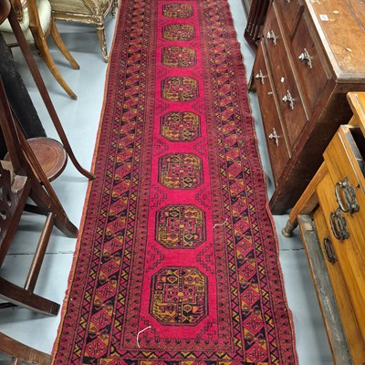 Lot 994 - An Afghan bokhara runner 290 x 87cms and a...