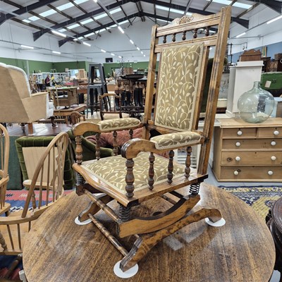 Lot 899 - An antique American rocking chair.