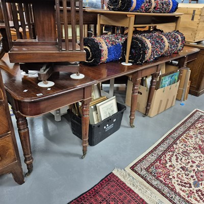 Lot 906 - A large early 19th-century mahogany dining...