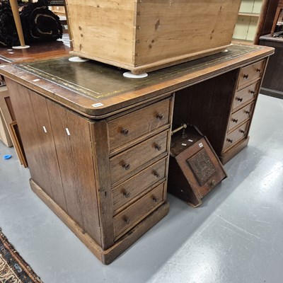 Lot 910 - A large Victorian oak twin pedestal desk. H 77...