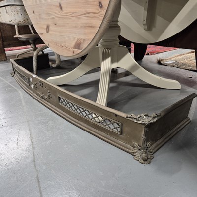 Lot 928 - An antique brass fire fender.