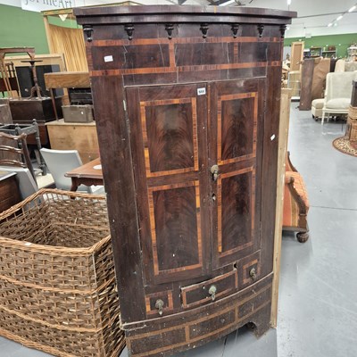 Lot 944 - A large George III mahogany bow-front corner...