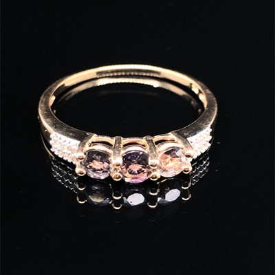 Lot 170 - A 9ct hallmarked gold three-stone polychroic...