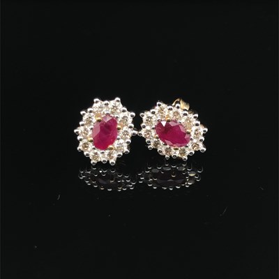 Lot 171 - A pair of oval ruby round brilliant cut...
