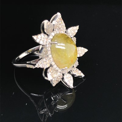 Lot 172 - A floral style ring set with a central oval...