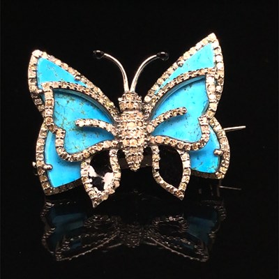 Lot 185 - A butterfly brooch set with turquoise and...