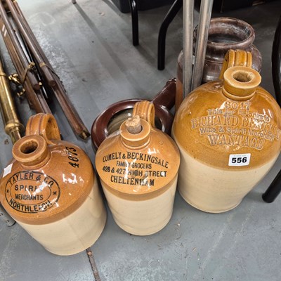 Lot 556 - Three various flagons and two stone ware pots