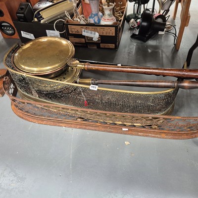 Lot 565 - Three warming pans and two fire fenders.