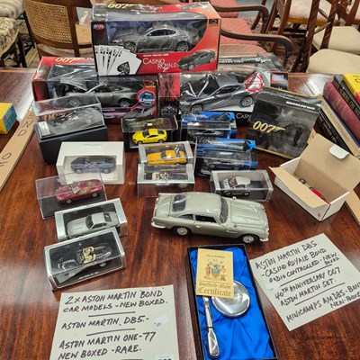 Lot 583 - A quantity of die-cast James Bond Aston Martin...