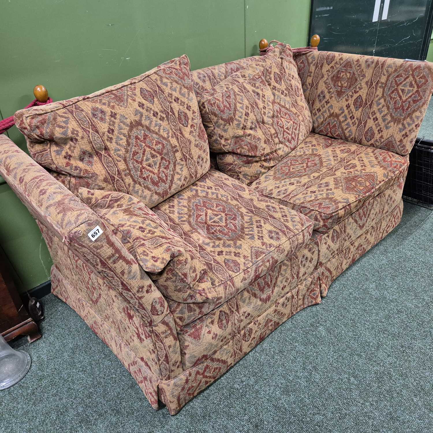 Lot 657 - A Knowle sofa. H 88 W 190 D 94cms