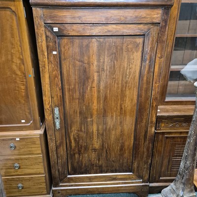 Lot 659 - A large continental panel door hall cabinet.