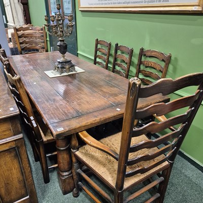 Lot 666 - A bespoke oak refectory type table and eight...