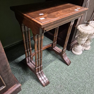 Lot 673 - A mahogany nest of tables.