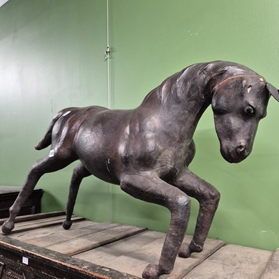 Lot 680 - A leather model of a horse.