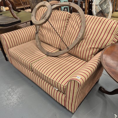 Lot 697 - A modern two seat sofa. H 77 W 135 D 82cms