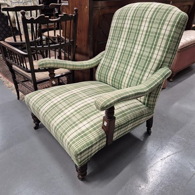 Lot 709 - A Victorian deep seat armchair.