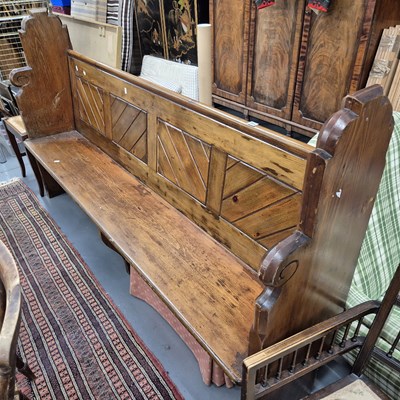 Lot 711 - An antique pine pew. H 115 W 201 D 41cms