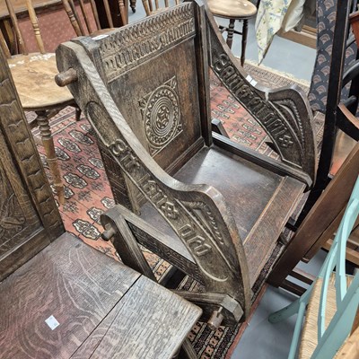 Lot 716 - A Carved oak Glastonbury chair.