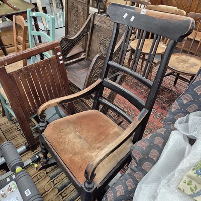 Lot 717 - An antique rocking chair.