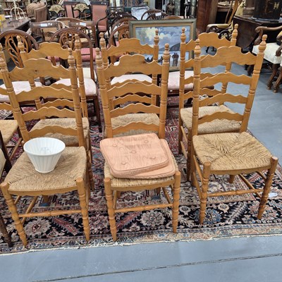 Lot 733 - A set of rush seta pine ladder back chairs.
