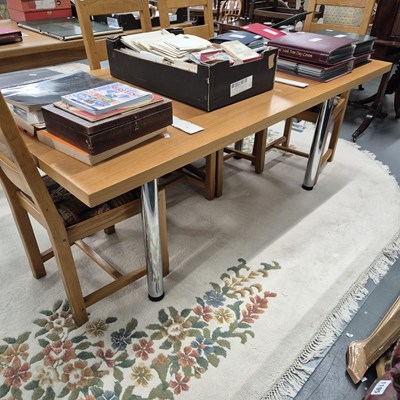 Lot 735 - A chrome legged office table.