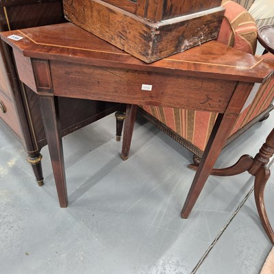 Lot 738 - A mahogany corner table. H 71cms