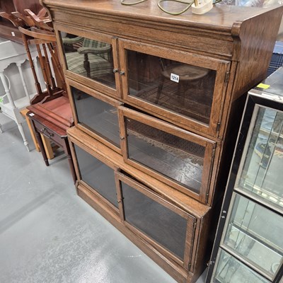 Lot 1214 - A vintage sectional bookcase