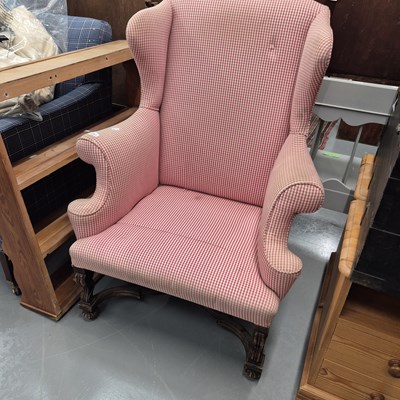 Lot 1221 - A Georgian style wing back armchair