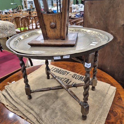 Lot 1229 - A brass topped occasional table, a plant stand...