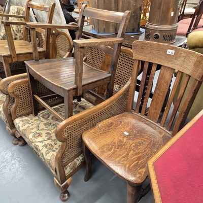 Lot 1234 - An oak desk chair and two slat seated armchairs