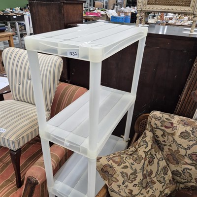 Lot 1237 - A plastic shelf unit