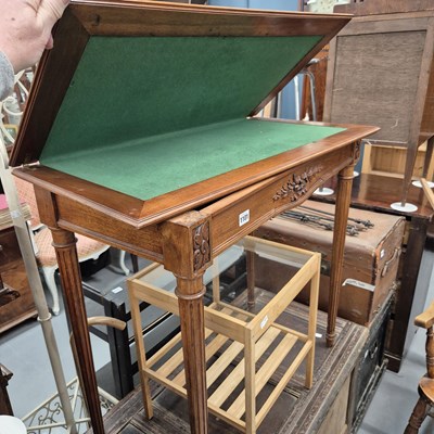 Lot 1101 - An early 20th century fold over card table