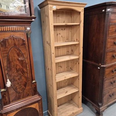 Lot 1110 - A pine tall bookcase