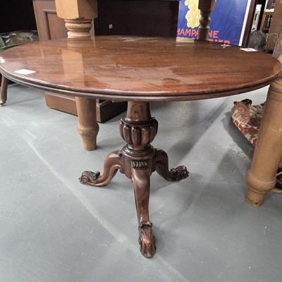Lot 1130 - A Victorian mahogany low tripod table with...