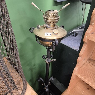 Lot 1138 - A brass and iron standard lamp
