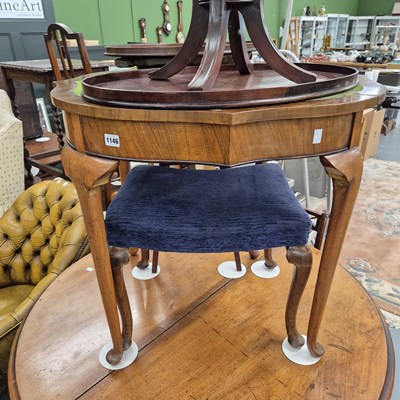 Lot 1146 - A small walnut foldover card table