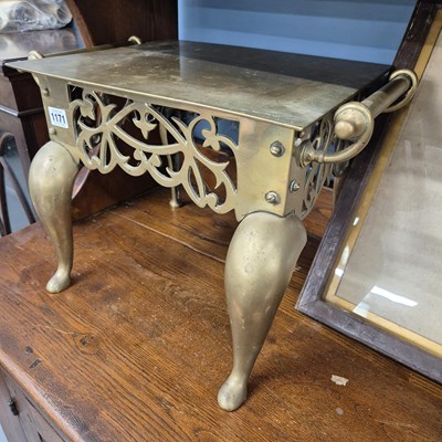 Lot 1171 - An antique brass footman