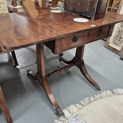 Lot 1191 - A small 19th century sofa table on sabre legs