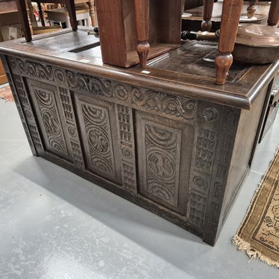 Lot 1001 - A georgian carved oak coffer
