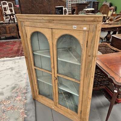 Lot 1014 - A large pine glazed corner cabinet. H132 x W94...