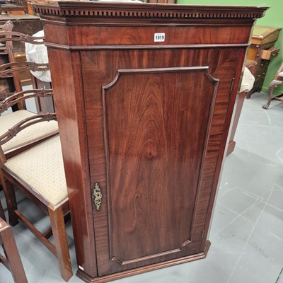 Lot 1019 - A 19th century mahogany corner cabinet