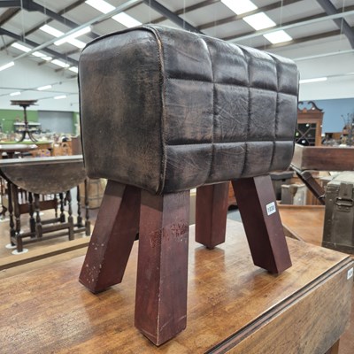 Lot 1030 - A leather stool