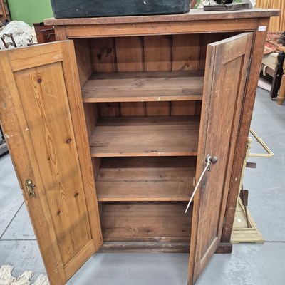 Lot 1034 - A pine two door cabinet. H 130 W 82 D 52.5cms
