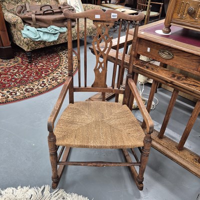 Lot 1037 - A small rocking chair