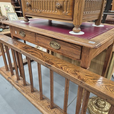 Lot 1040 - An Edwardian oak writing table