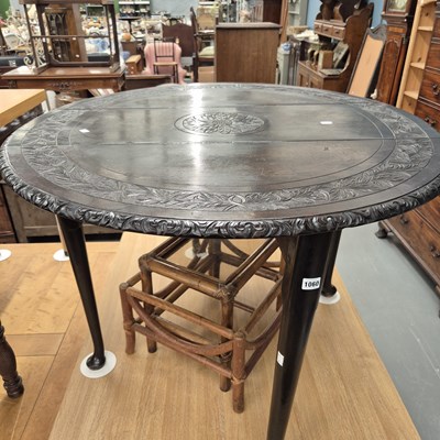 Lot 1060 - A carved oak gateleg table