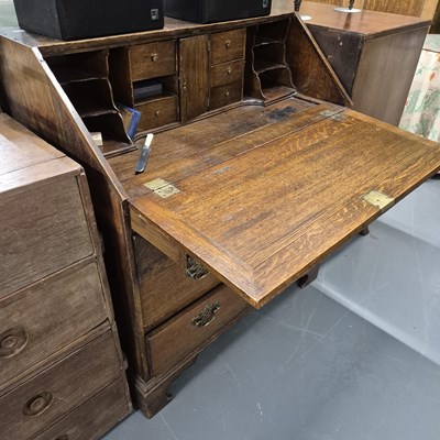 Lot 1072 - A georgian oak bureau
