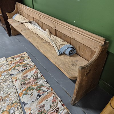 Lot 1076 - A small antique pine pew. H 55 W 198 D 32cms