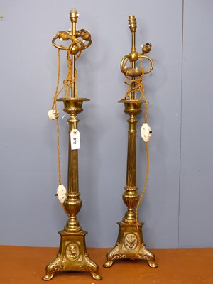 Lot 372 - A pair of floor standing brass uplighter lamps,...